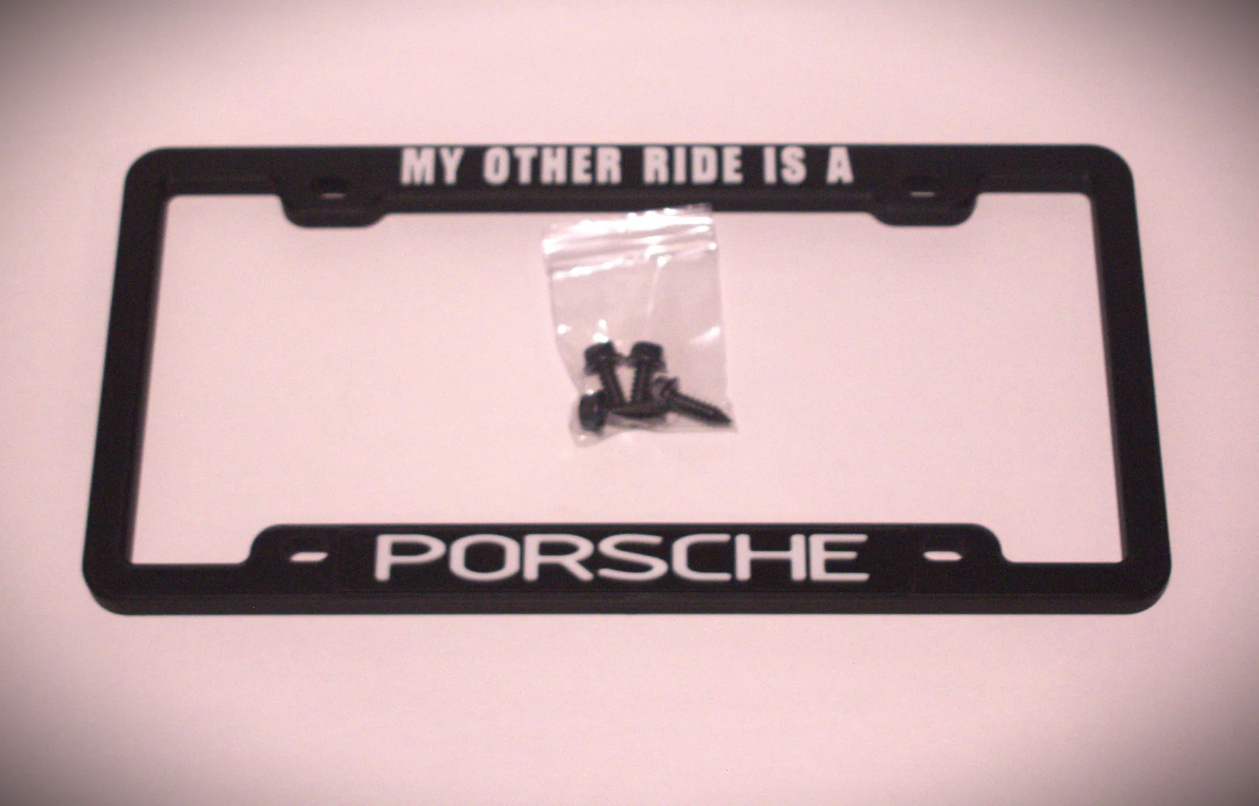 KT-34 magnetic license plate frame configured with personalized Porsche text plates